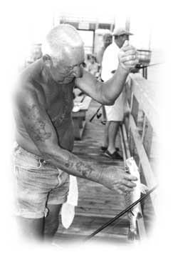 Lewis Winecoff, 71, is the ring-leader of a group of retirees who have fun fishing for speckled trout at Long Beach Pier.